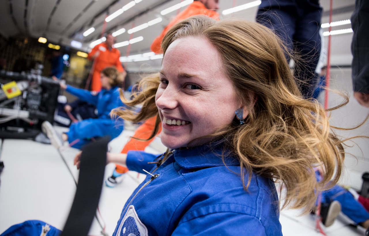 Female researcher onboard a zero-gravity parabolic flight.